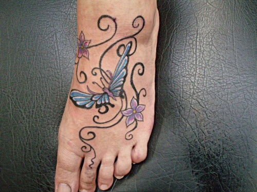 Женская тату цветок на ноге фото - 2
